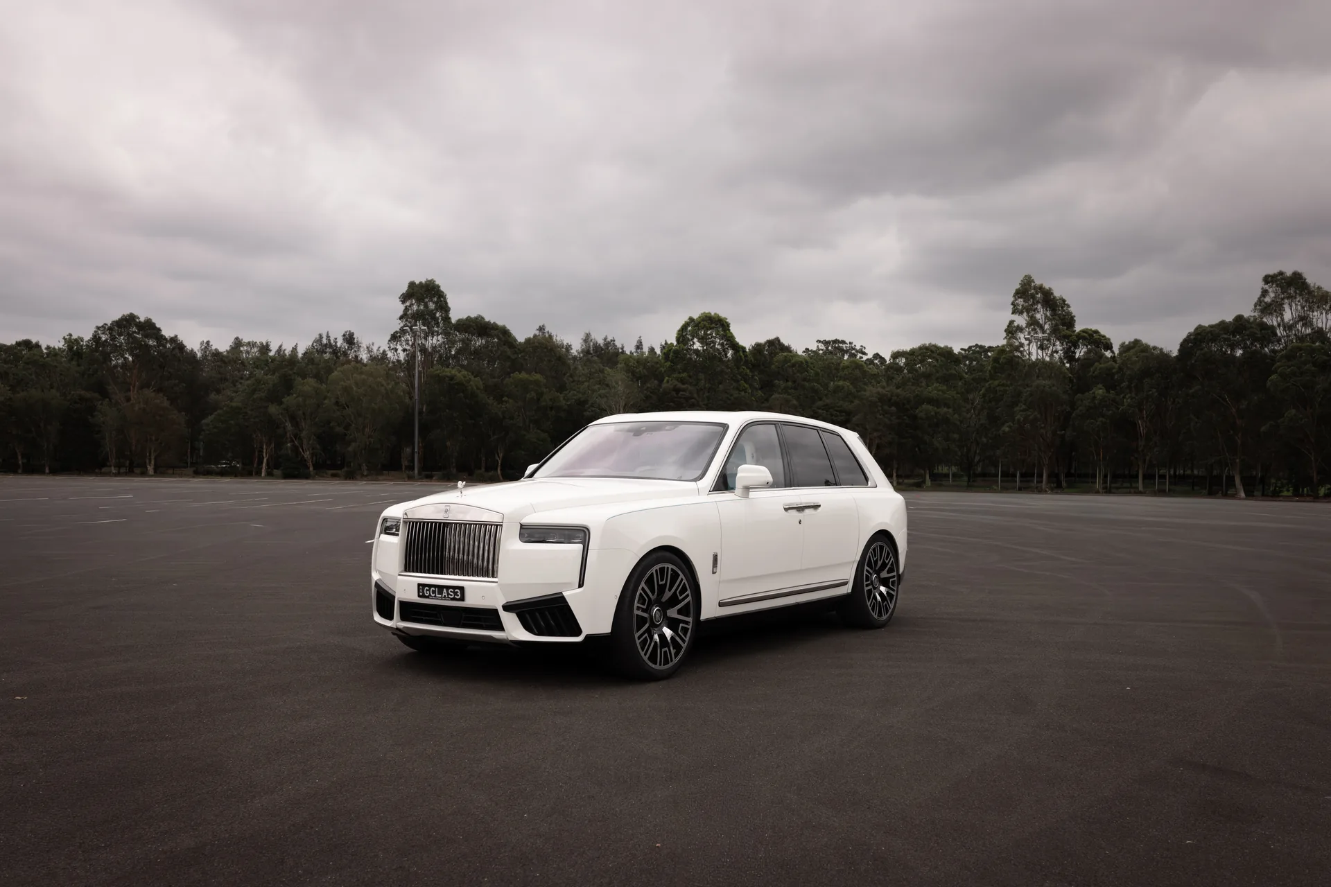 A white Rolls-Royce Cullinan, chauffeured hire in Sydney