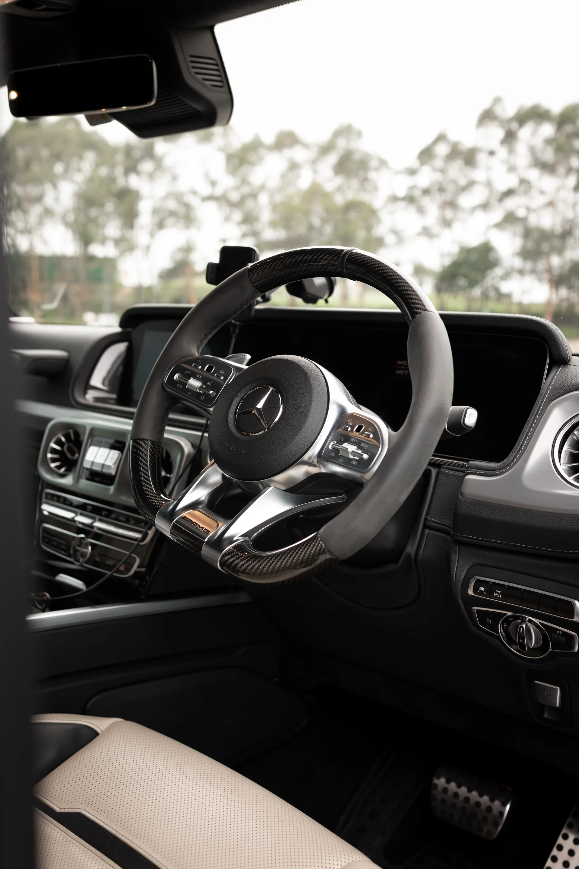 A white Mercedes-AMG G63 G-Wagon, chauffeured hire in Sydney