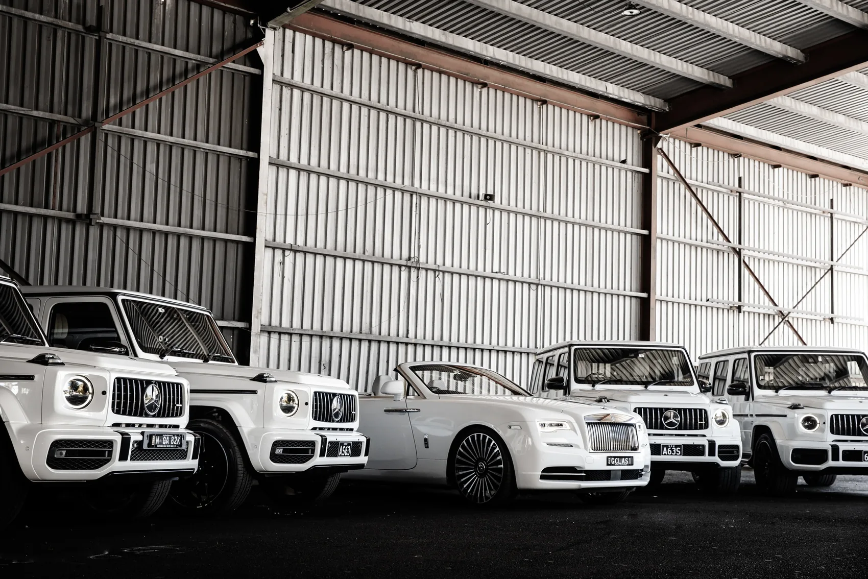 A white Rolls-Royce Dawn convertible, chauffeured hire in Sydney